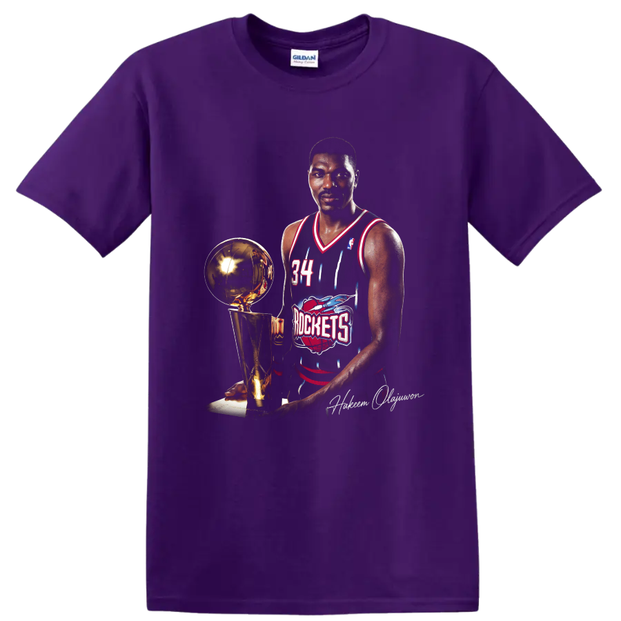 Hakeem Olajuwon in Houston Rockets No. 34 uniform beside championship trophy on a Purple T Shirt