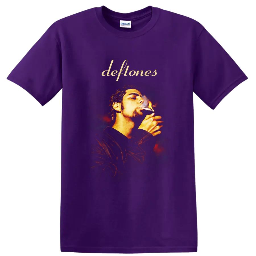 Deftones script above Chino Moreno smoking portrait with fiery smoky background on a Purple T Shirt