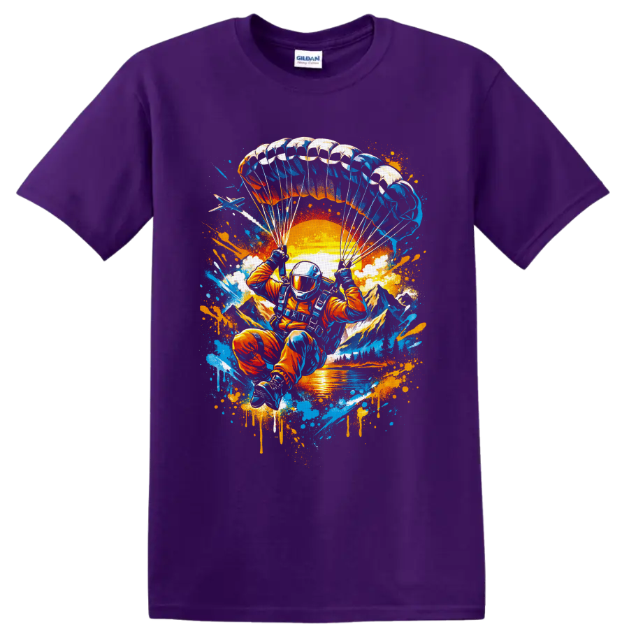 Skydiver under parachute over sunset mountains in vibrant graffiti splatter art on a Purple T Shirt