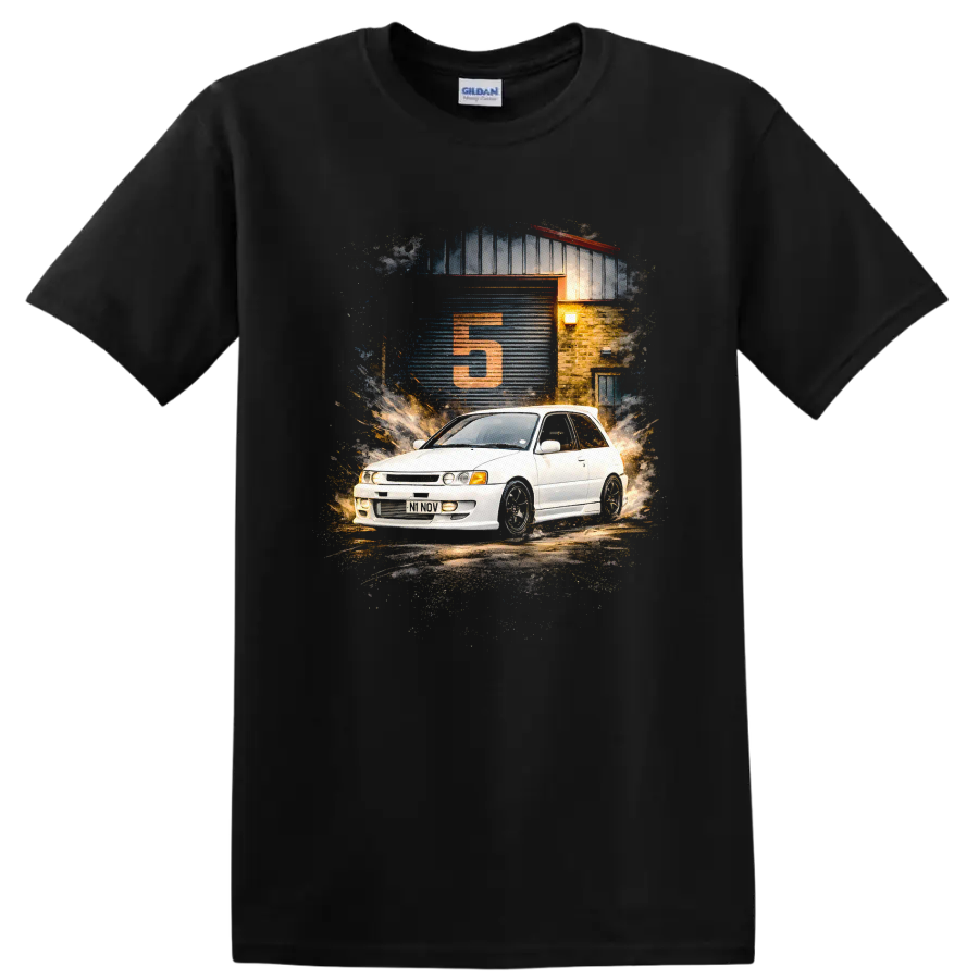 Toyota Starlet GT Turbo graphic print with white hatchback and garage scene on a Black T Shirt