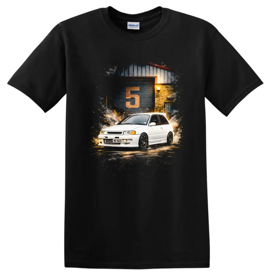 Toyota Starlet GT Turbo graphic print with white hatchback and garage scene on a Black T Shirt