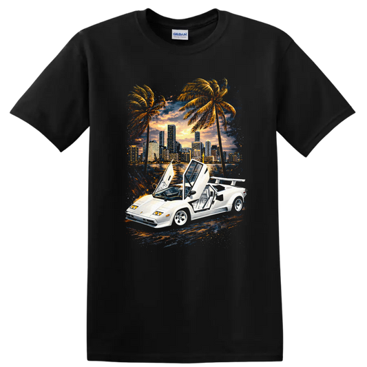 White Lamborghini Countach with raised doors, sunset skyline, palm trees, graphic print T-shirt on a Black T Shirt