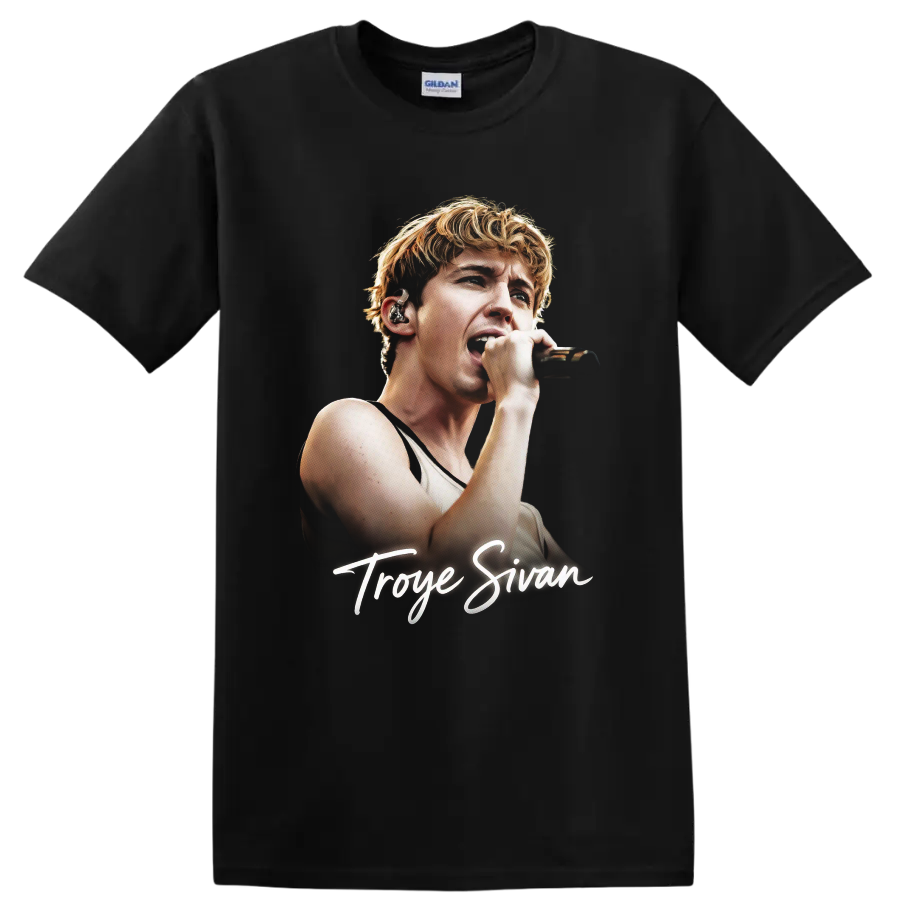 Troye Sivan singing into a microphone with signature script on a Black T Shirt