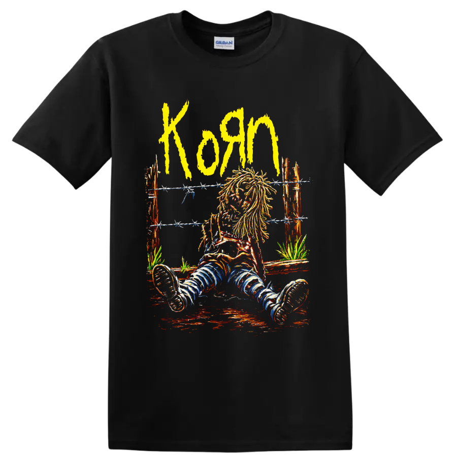 Korn yellow wordmark and seated long-haired figure behind barbed wire on a Black T Shirt