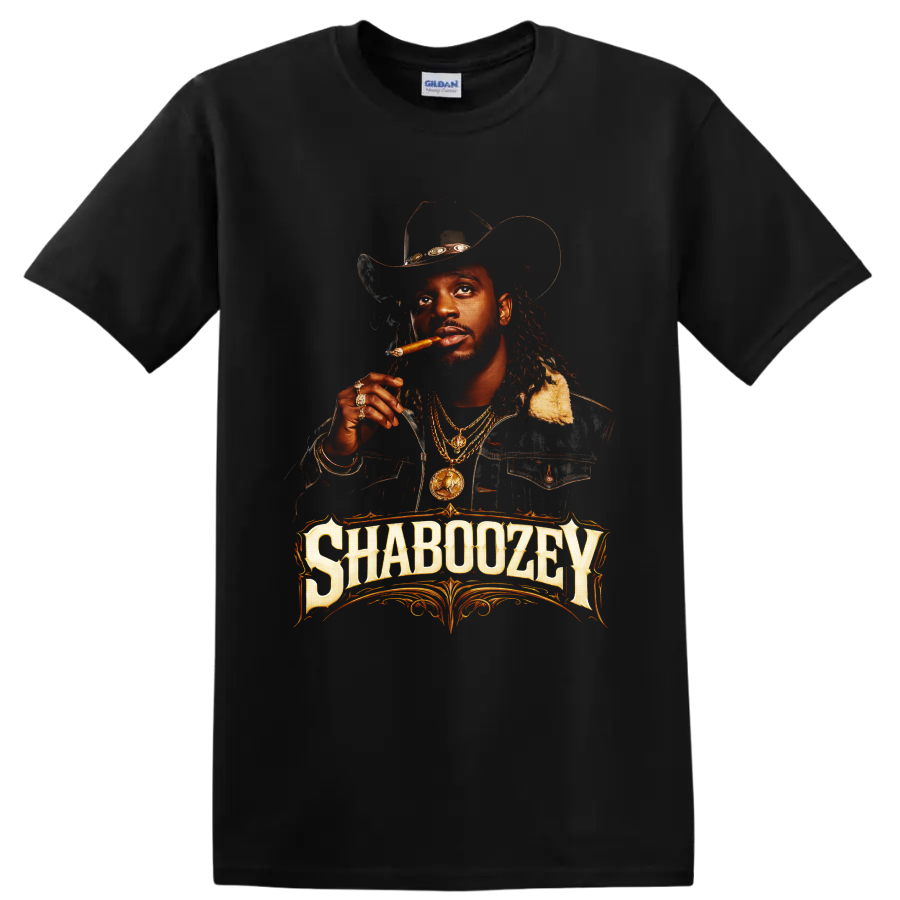 Shaboozey cowboy hat portrait with cigar, gold chains, and ornate western lettering on a Black T Shirt
