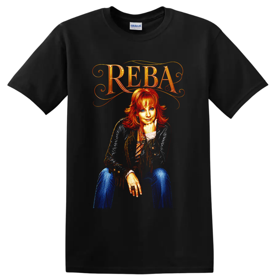 Reba McEntire portrait with ornate REBA lettering, fringe jacket, and vivid western art on a Black T Shirt