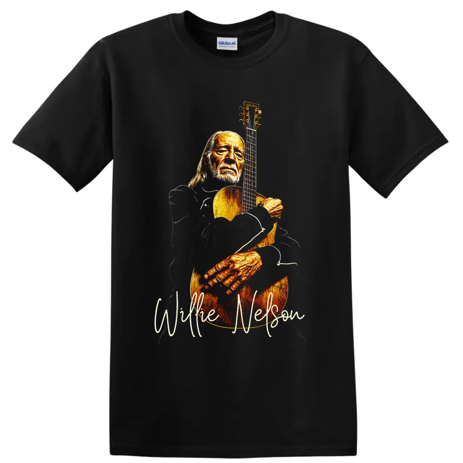 Willie Nelson holding an acoustic guitar in a warm vintage-style portrait on a Black T Shirt