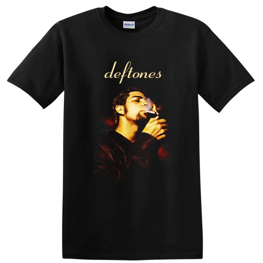 Deftones script above Chino Moreno smoking portrait with fiery smoky background on a Black T Shirt