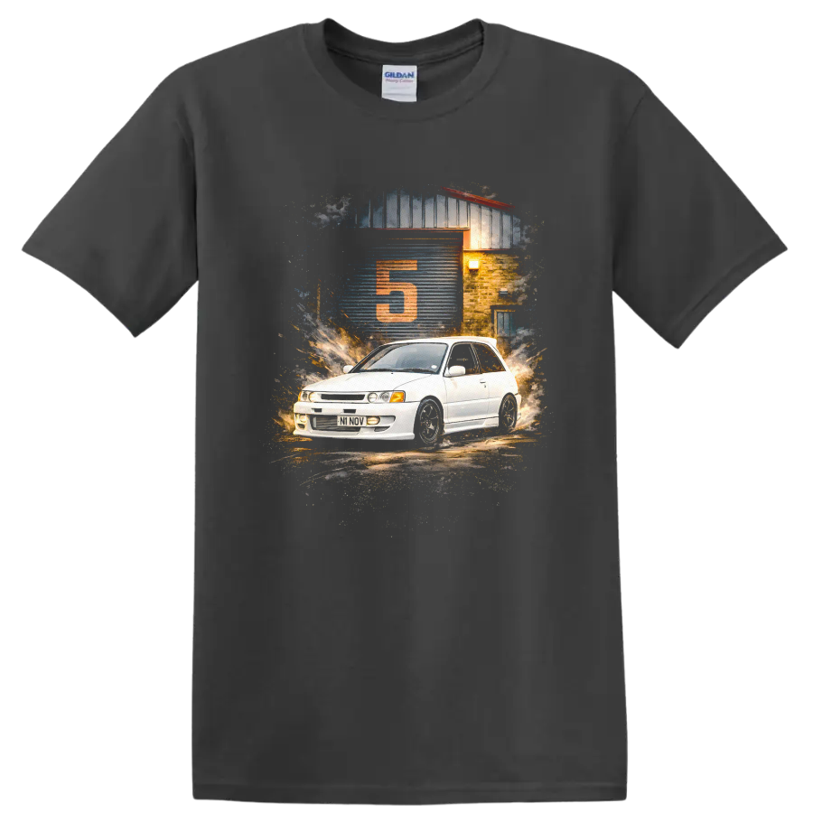 Toyota Starlet GT Turbo graphic print with white hatchback and garage scene on a Charcoal T Shirt
