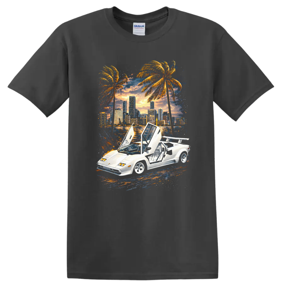 White Lamborghini Countach with raised doors, sunset skyline, palm trees, graphic print T-shirt on a Charcoal T Shirt