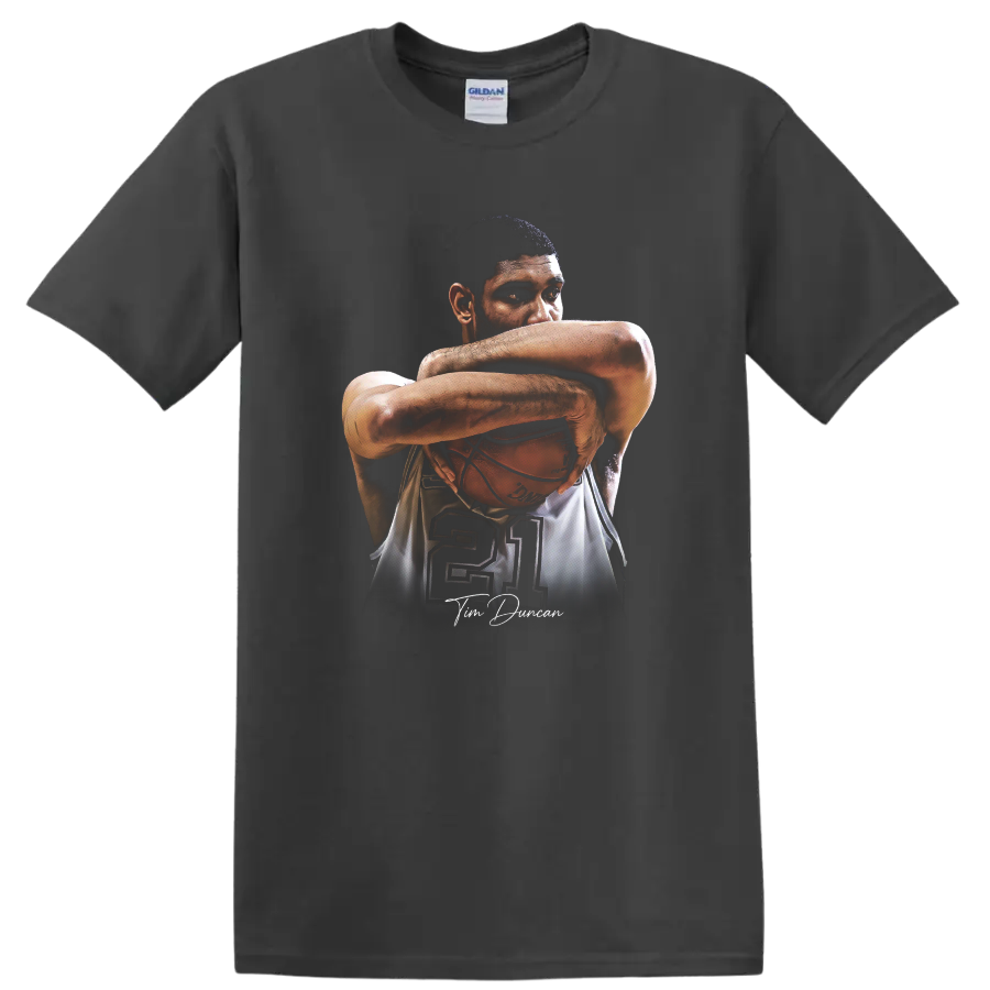 Tim Duncan portrait cradling basketball with number 21 and signature-style script on a Charcoal T Shirt