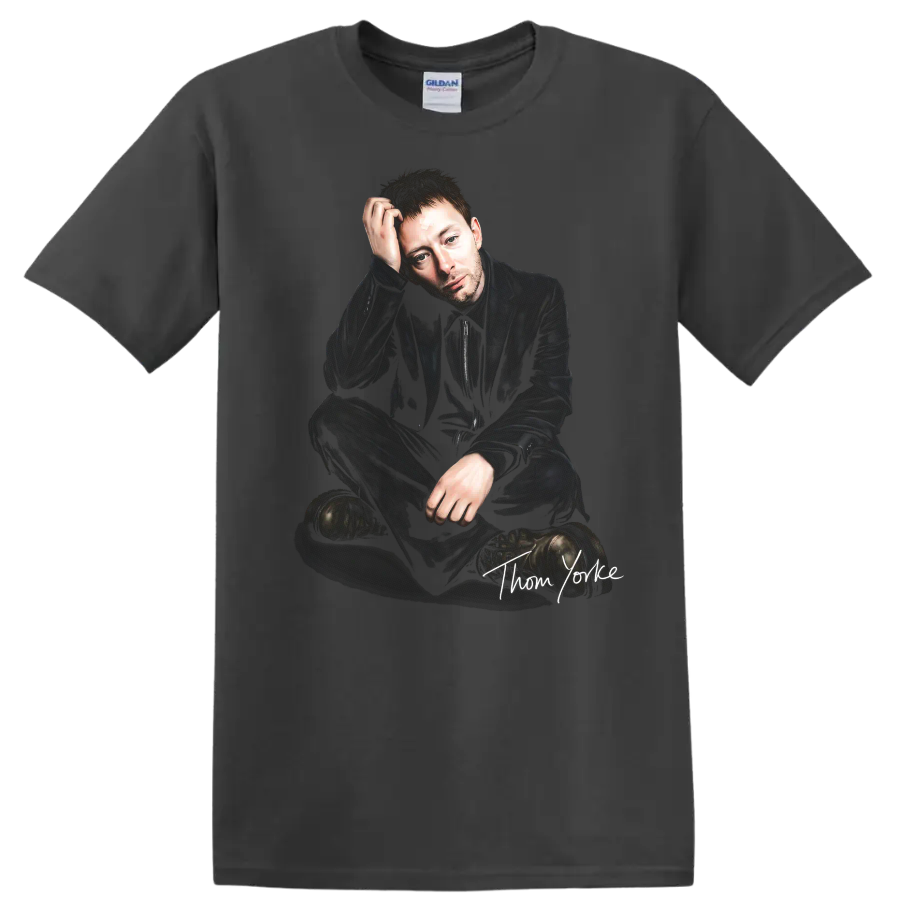 Thom Yorke seated portrait with handwritten signature, dark alternative rock style on a Charcoal T Shirt