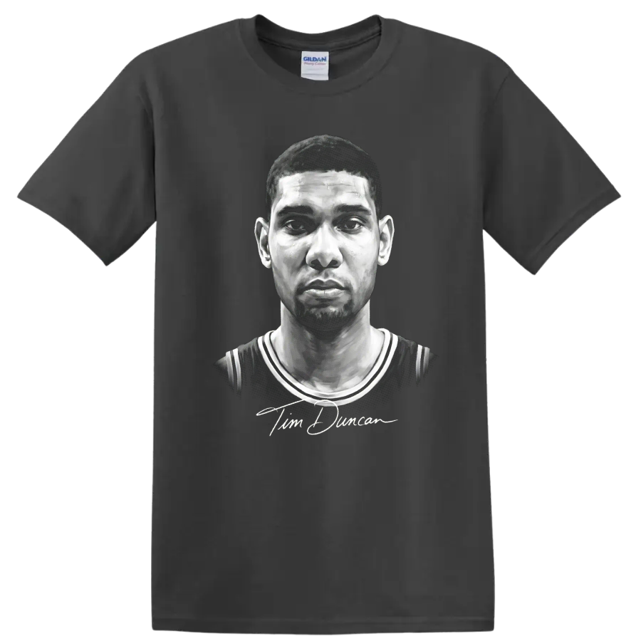 Grayscale Tim Duncan basketball portrait in No. 21 jersey with signature-style script on a Charcoal T Shirt