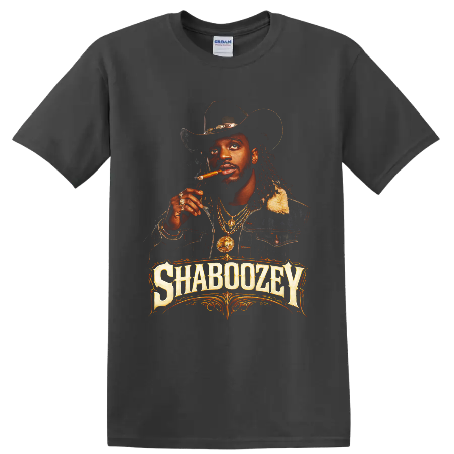 Shaboozey cowboy hat portrait with cigar, gold chains, and ornate western lettering on a Charcoal T Shirt