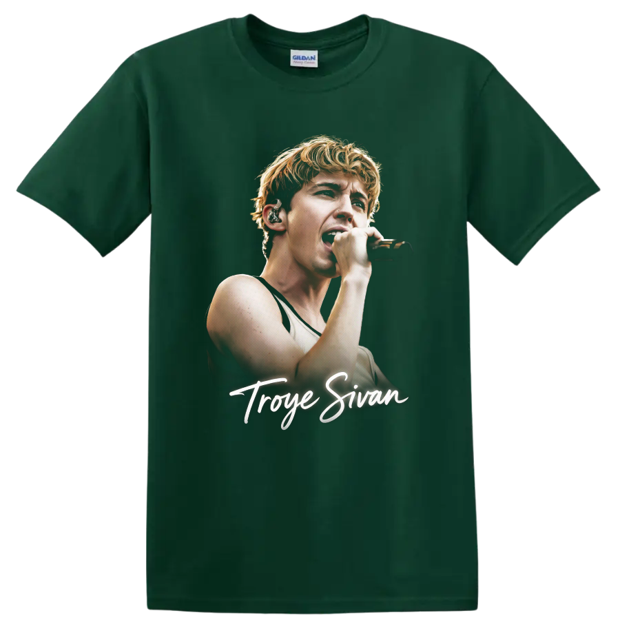 Troye Sivan singing into a microphone with signature script on a Forest Green T Shirt