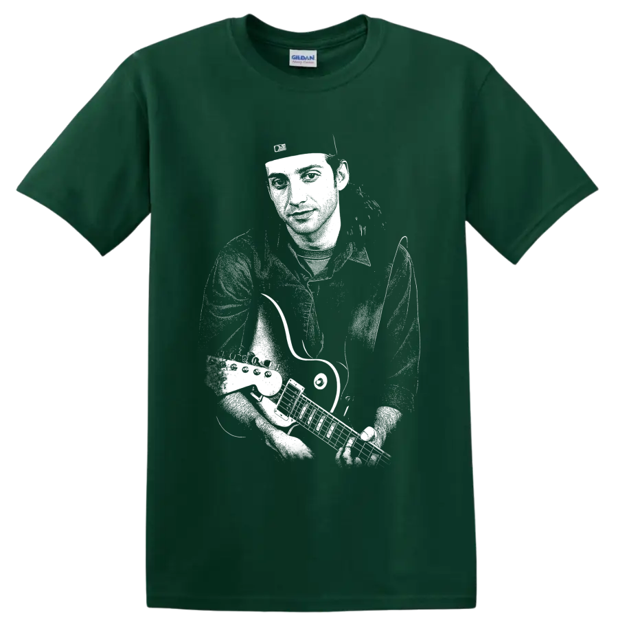 High-contrast monochrome portrait of Stone Gossard playing guitar on a Forest Green T Shirt