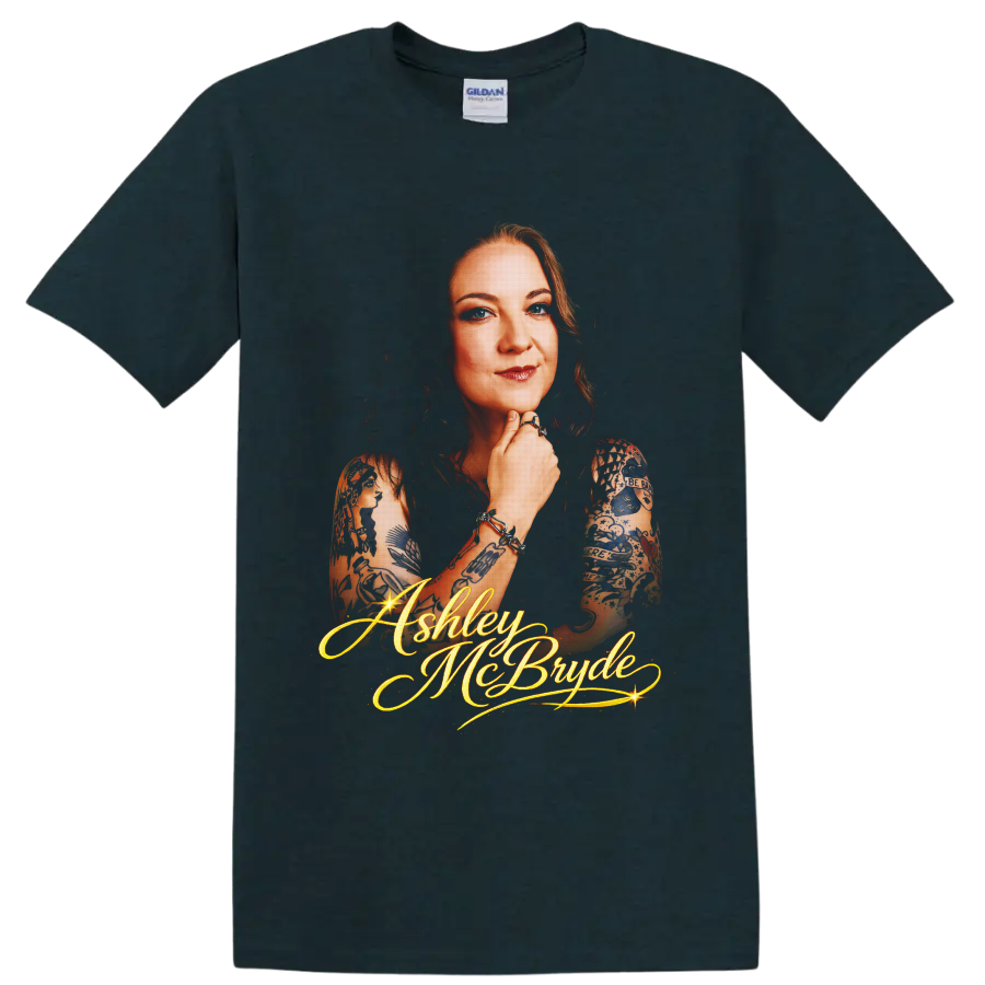 Ashley McBryde portrait with tattoo art and glowing gold script lettering on a Midnight (Green) T Shirt