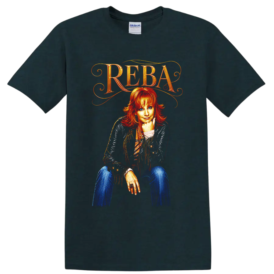Reba McEntire portrait with ornate REBA lettering, fringe jacket, and vivid western art on a Midnight (Green) T Shirt