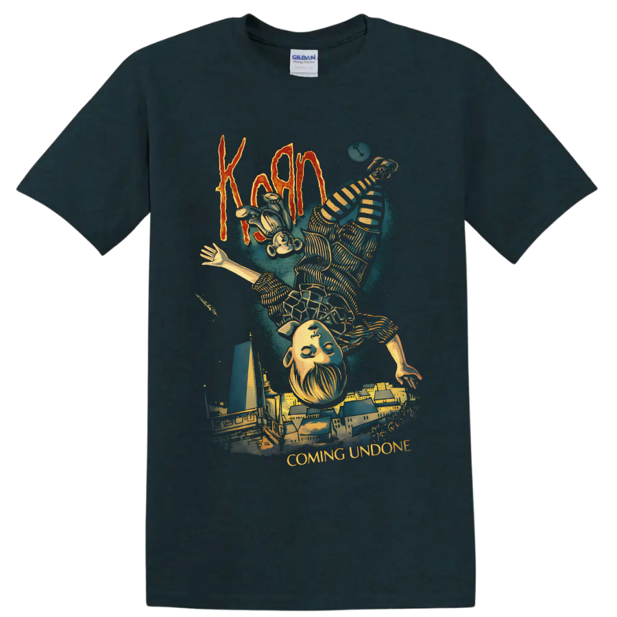 Korn Coming Undone art with upside-down striped figure and surreal cityscape on a Midnight (Green) T Shirt