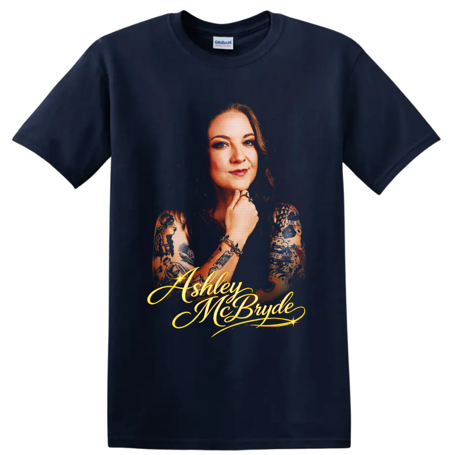 Ashley McBryde portrait with tattoo art and glowing gold script lettering on a Navy (Blue) T Shirt