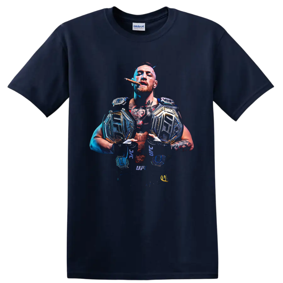 Conor McGregor with championship belts in a dramatic blue-and-gold MMA portrait on a Navy (Blue) T Shirt