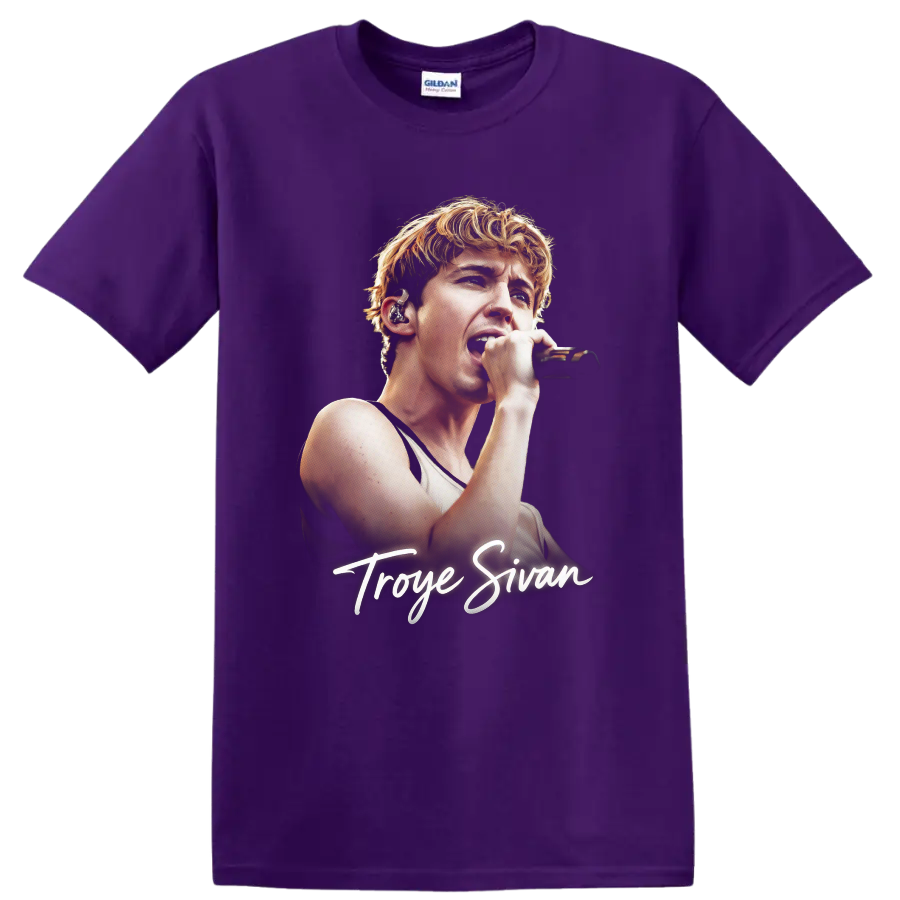Troye Sivan singing into a microphone with signature script on a Purple T Shirt