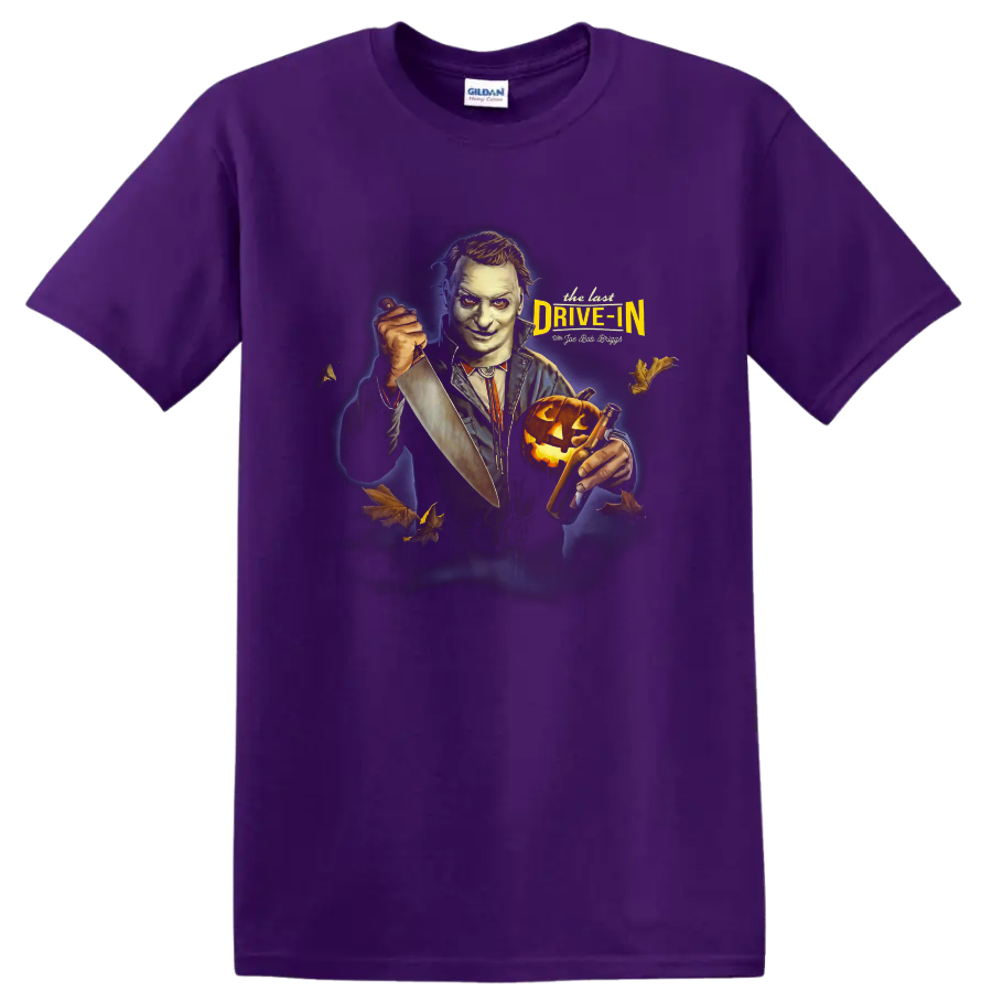 The Last Drive In 2 horror movie host with knife and pumpkin graphic on a Purple T Shirt