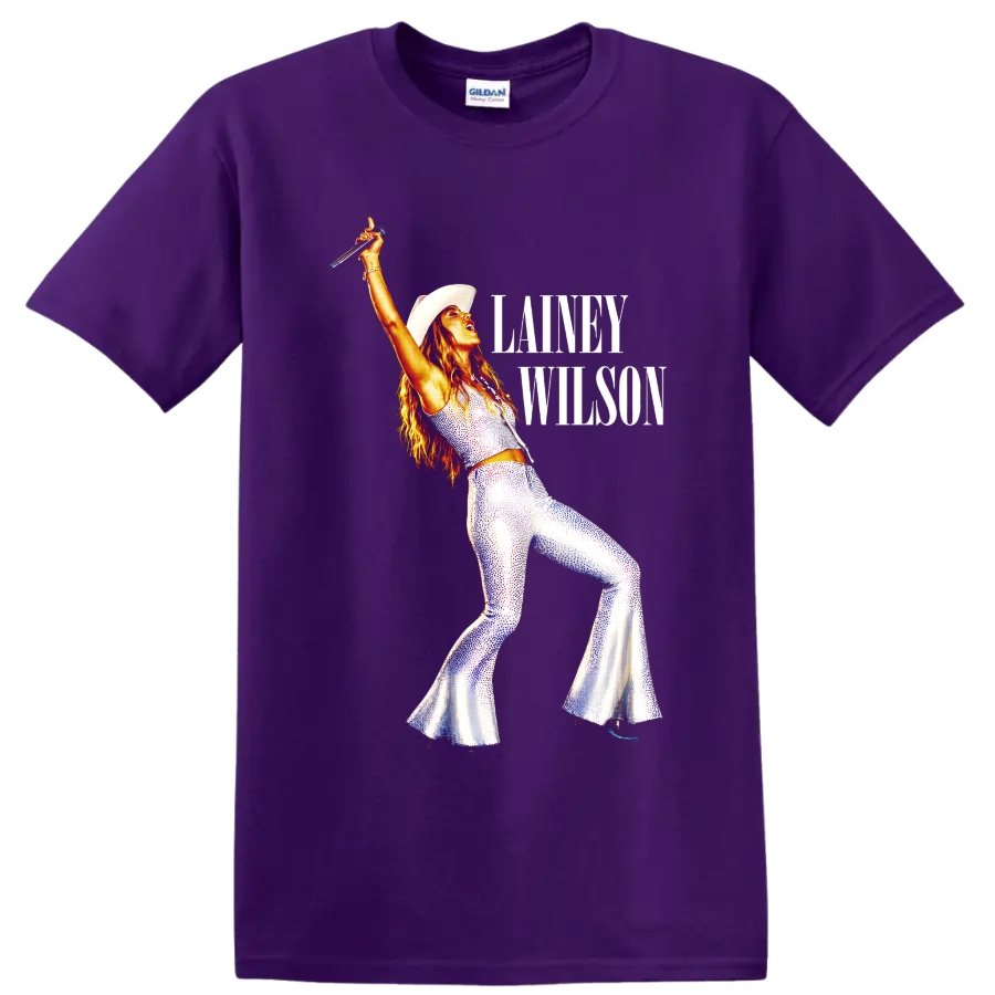 Lainey Wilson in cowboy hat and sparkling stagewear with raised microphone and text on a Purple T Shirt
