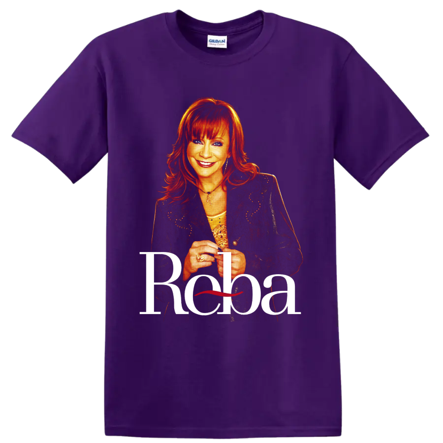 Reba McEntire portrait with red hair, sparkling jacket, and large Reba lettering on a Purple T Shirt
